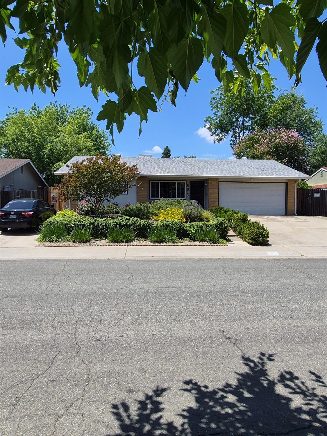 5817 Keyntel Street Citrus Heights, CA 95621 - Photo 1 of 30 a front view of a house with a yard and garage