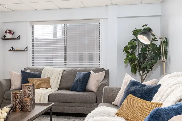 a living room with furniture and a window