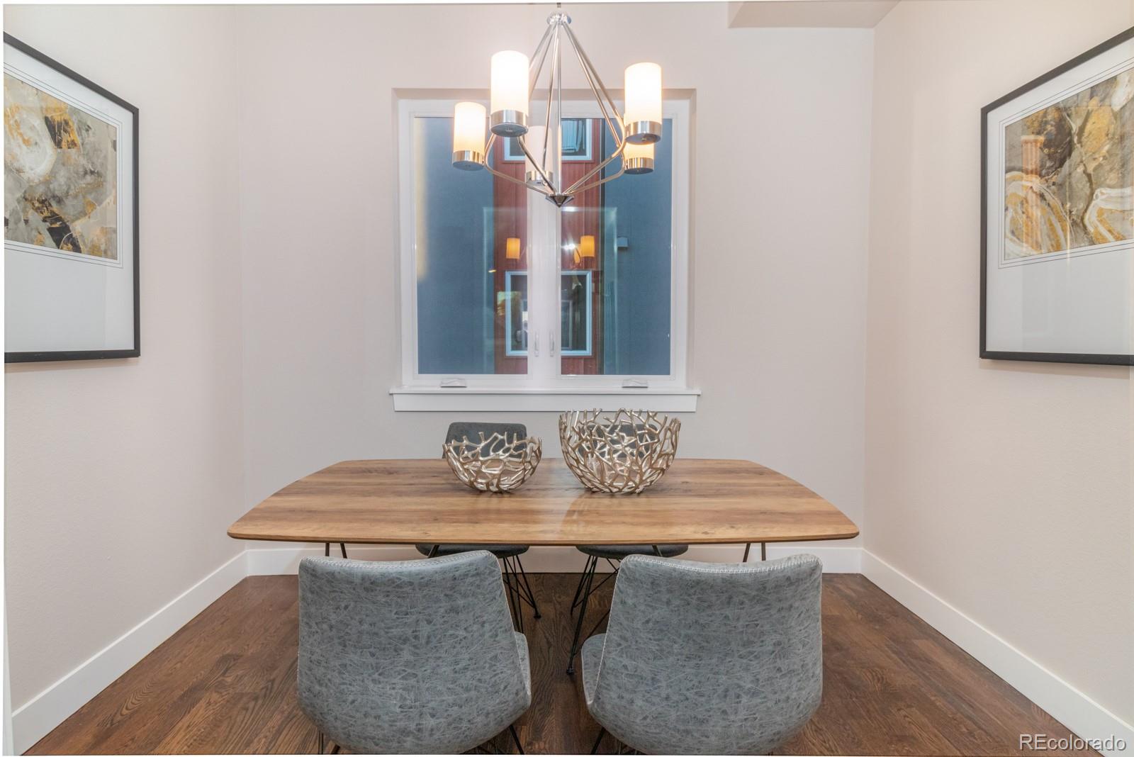 927 Inca Street, Unit 3 Denver, CO 80204 - Photo 11 of 24 a dining room with table chairs and wooden floor