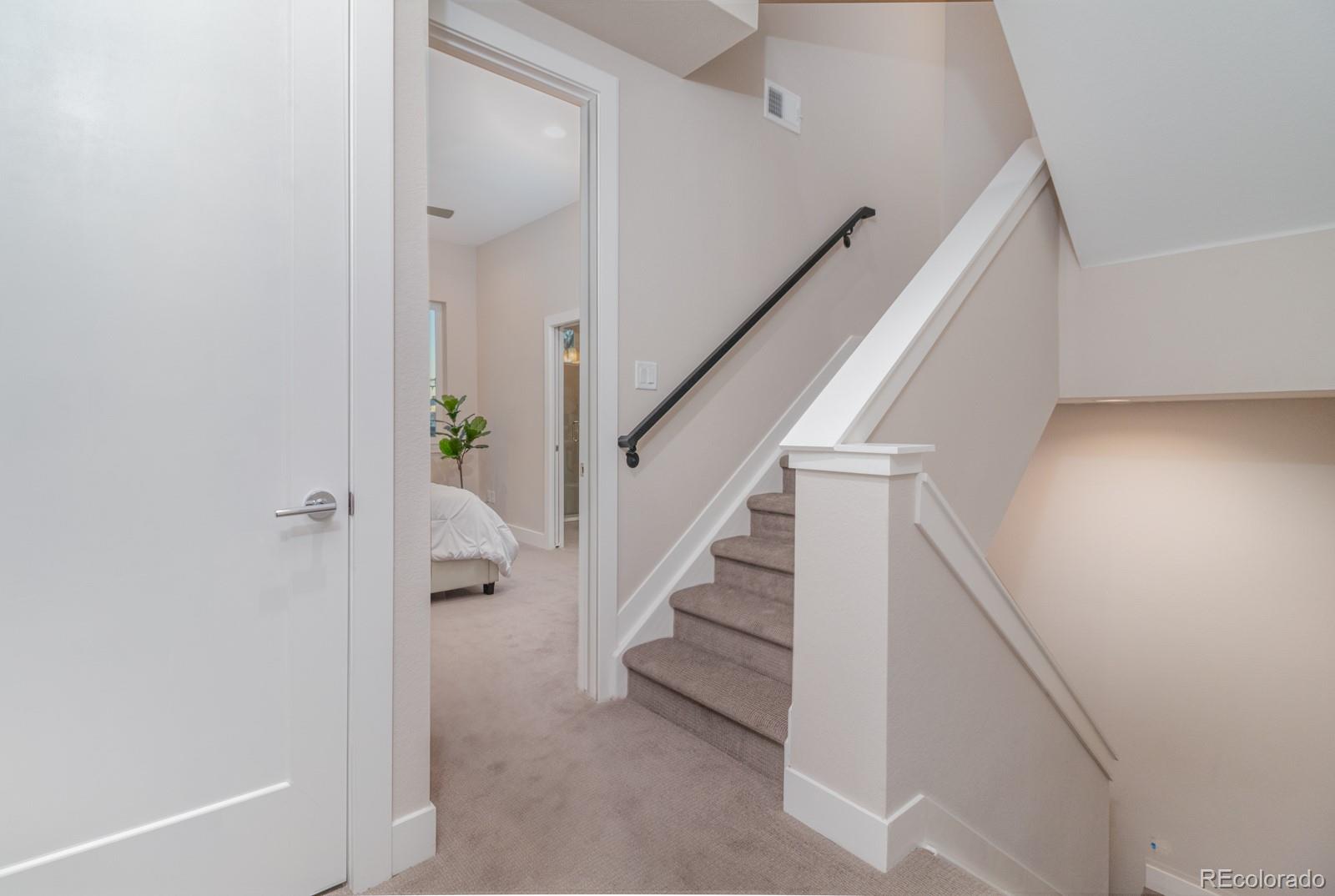 927 Inca Street, Unit 3 Denver, CO 80204 - Photo 12 of 24 a view of entryway with stairs and wooden floor