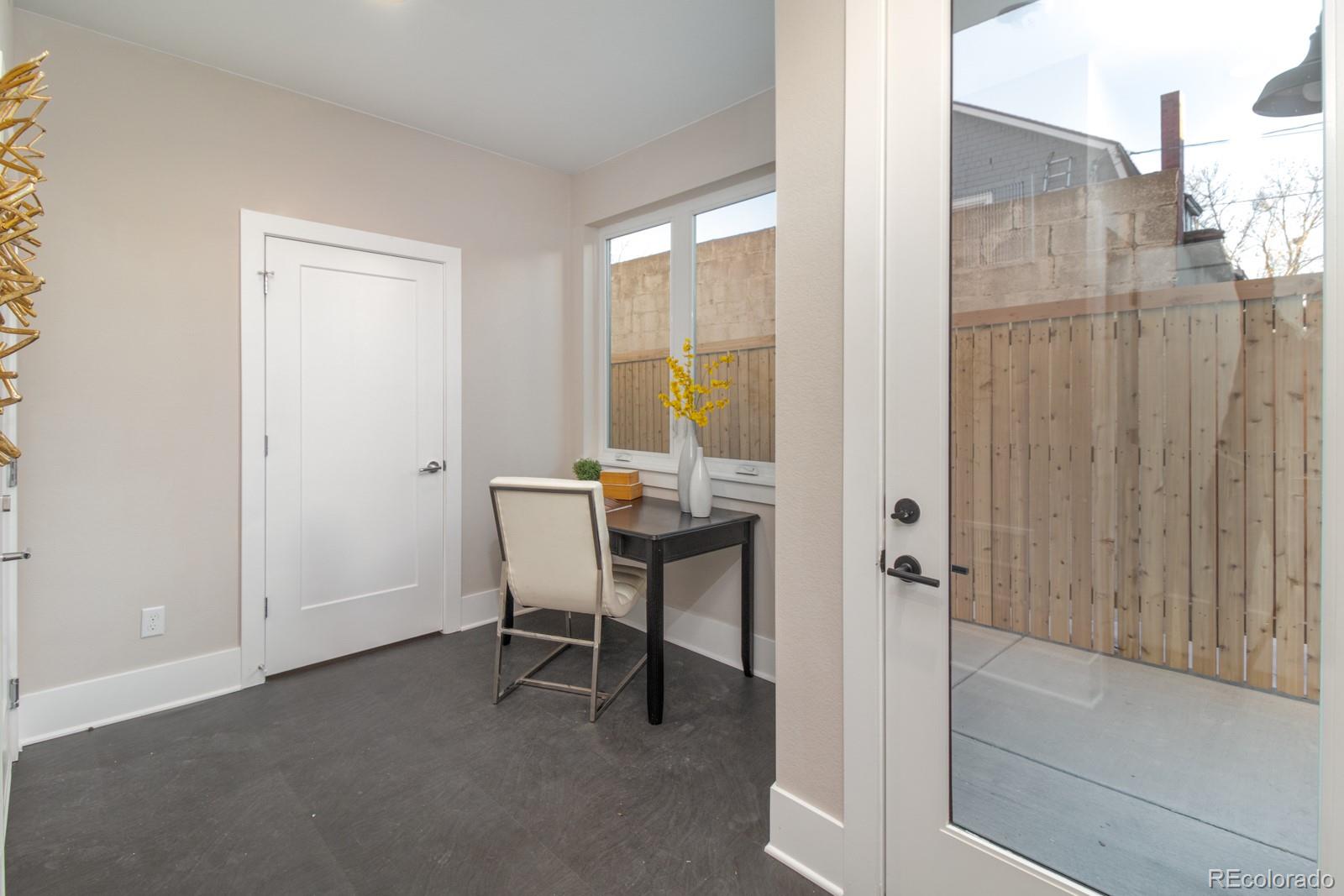 927 Inca Street, Unit 3 Denver, CO 80204 - Photo 3 of 24 a view of a room with a table and chair