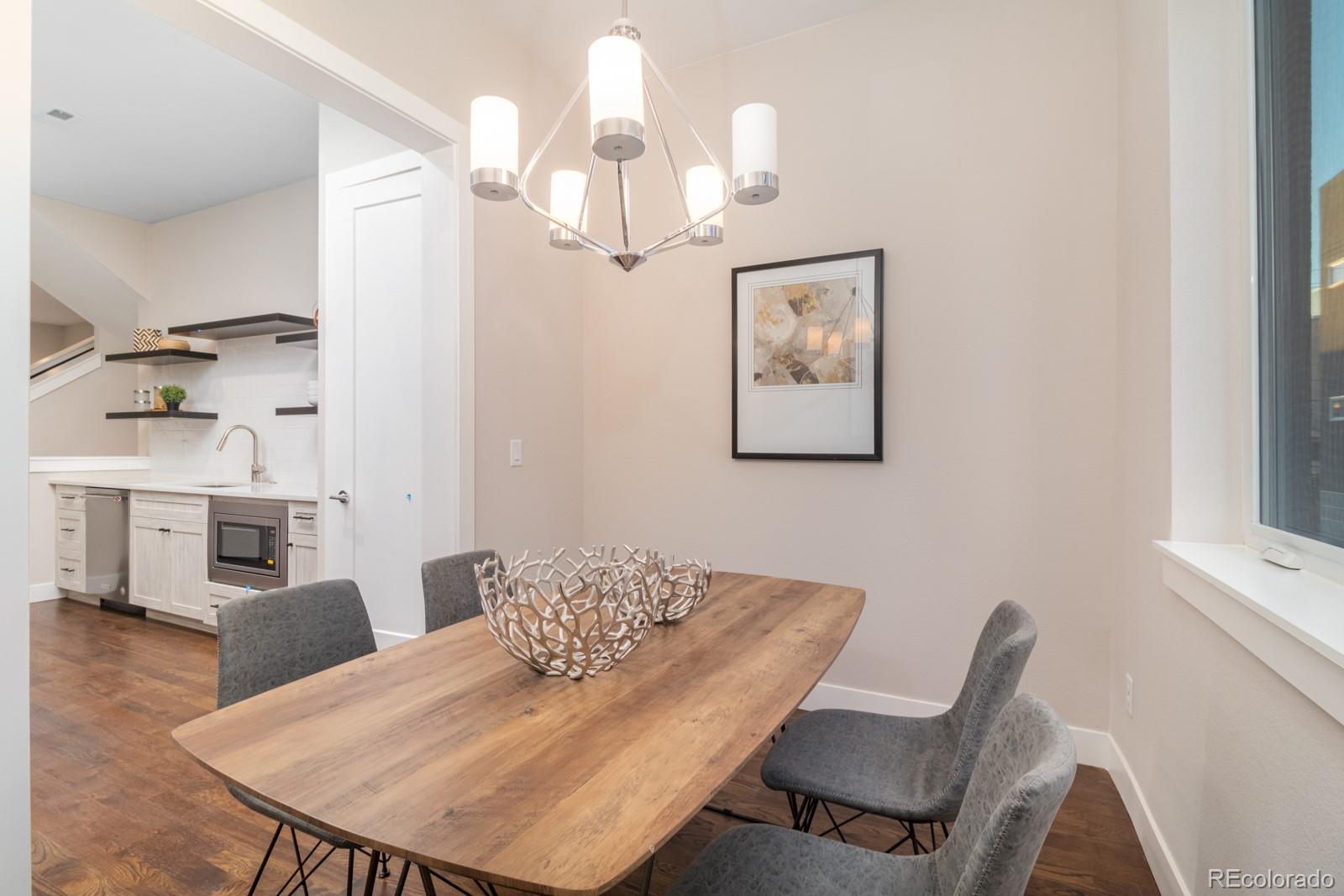927 Inca Street, Unit 3 Denver, CO 80204 - Photo 10 of 24 a view of a dining room with furniture and wooden floor