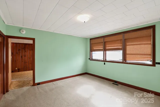 a view of an empty room with a fireplace