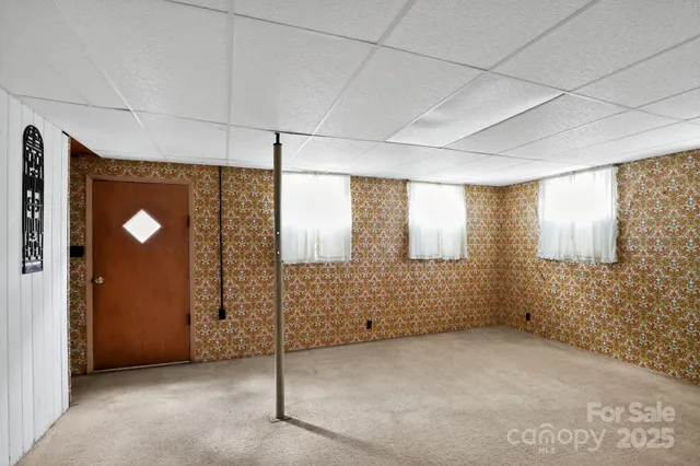 a view of an empty room with a fireplace