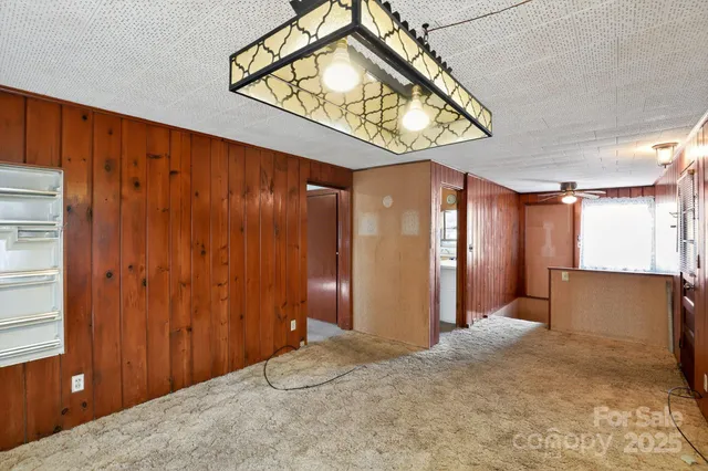 a view of a hallway to a bedroom