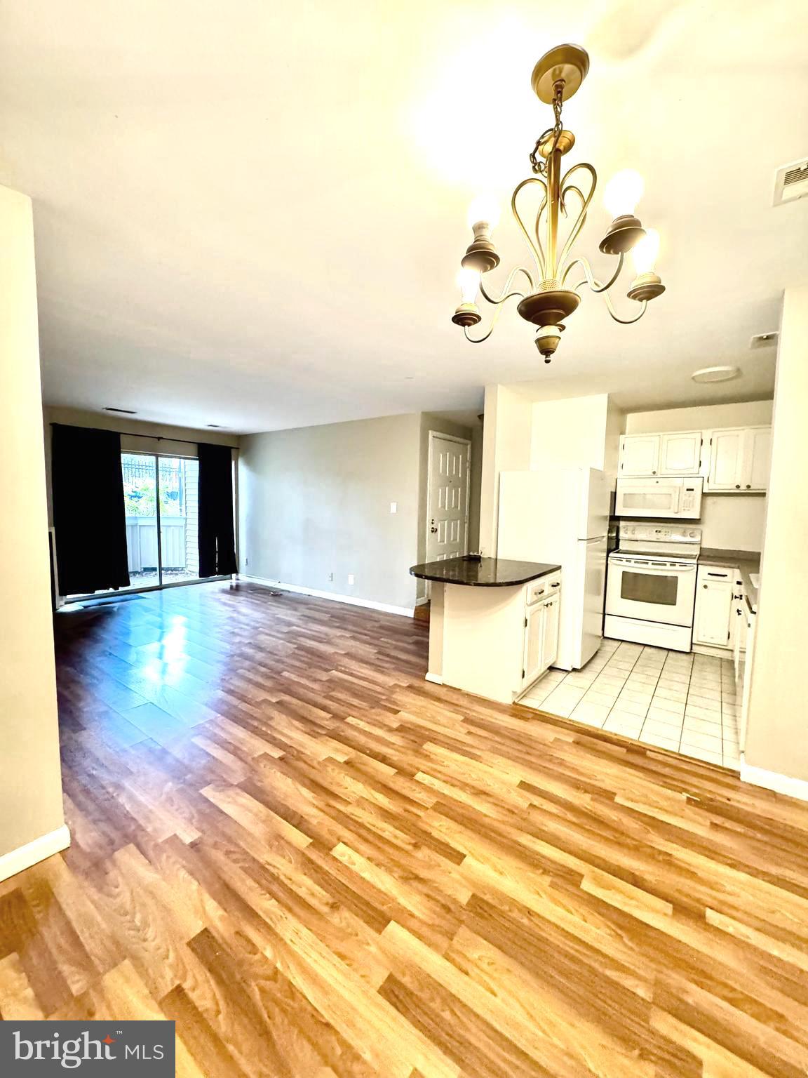 18237 Swiss Circle, Unit 131 Germantown, MD 20874 - Photo 11 of 22 Kitchen and living room view