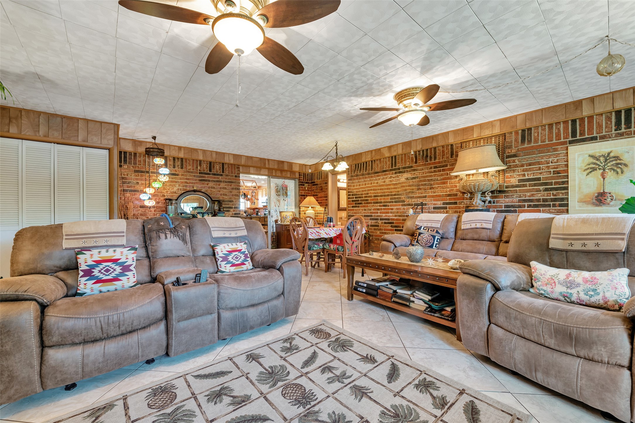2913 18th Avenue North Texas City, TX 77590 - Photo 16 of 42 a living room with furniture and a chandelier