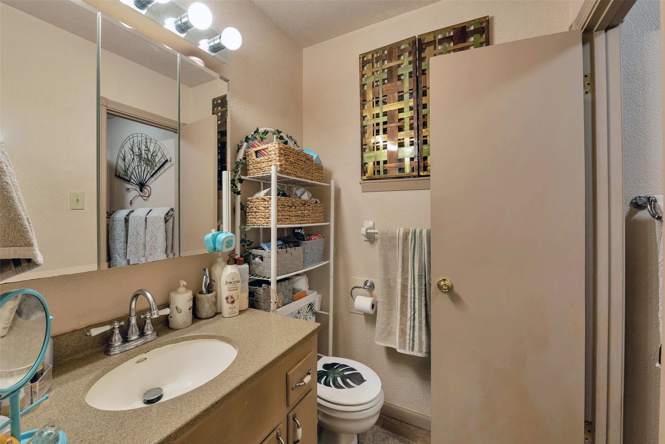 2913 18th Avenue North Texas City, TX 77590 - Photo 22 of 42 a bathroom with a sink a toilet and shower