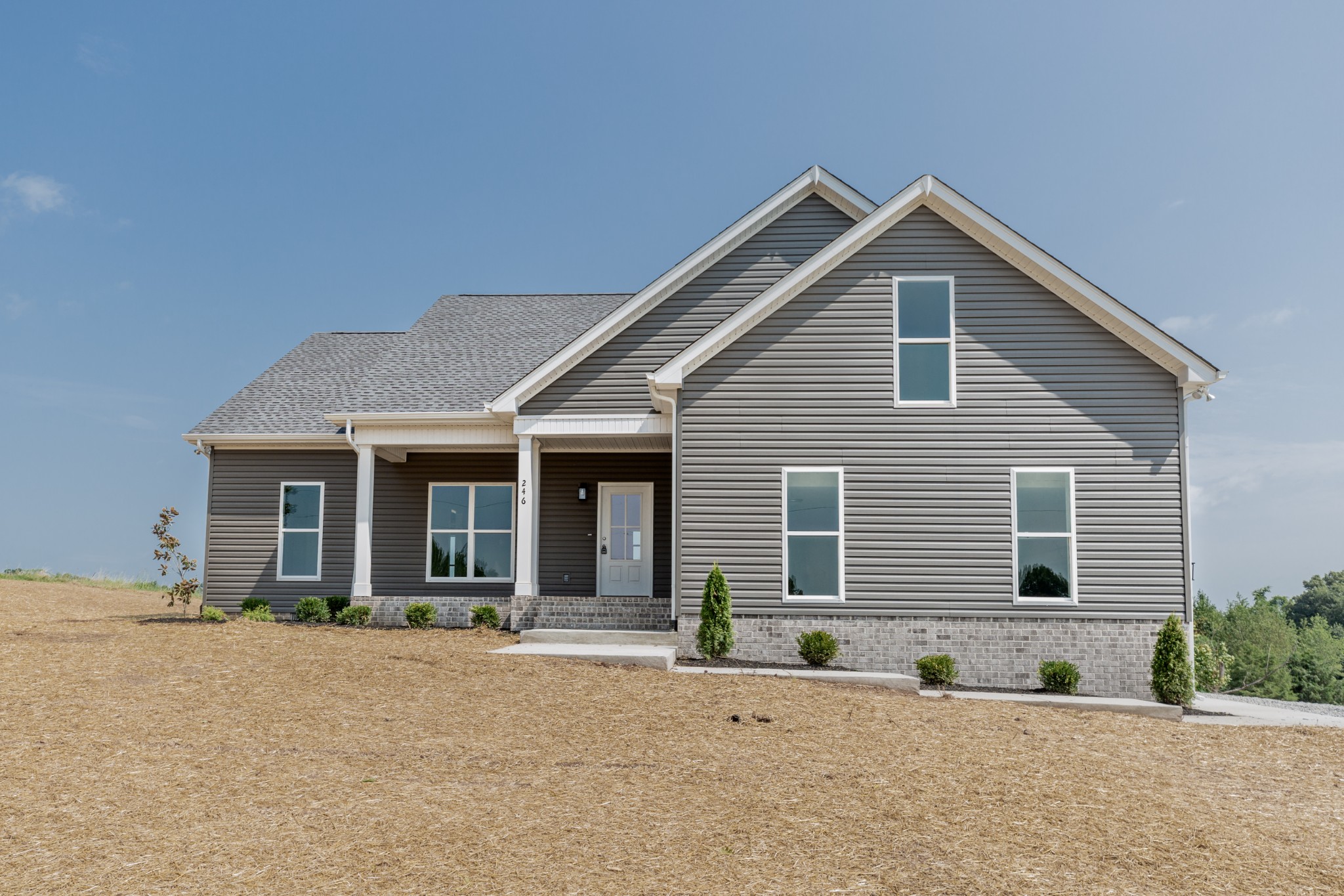 246 Woodruff Road Adams, TN 37010 - Photo 1 of 18 a front view of a house with a yard