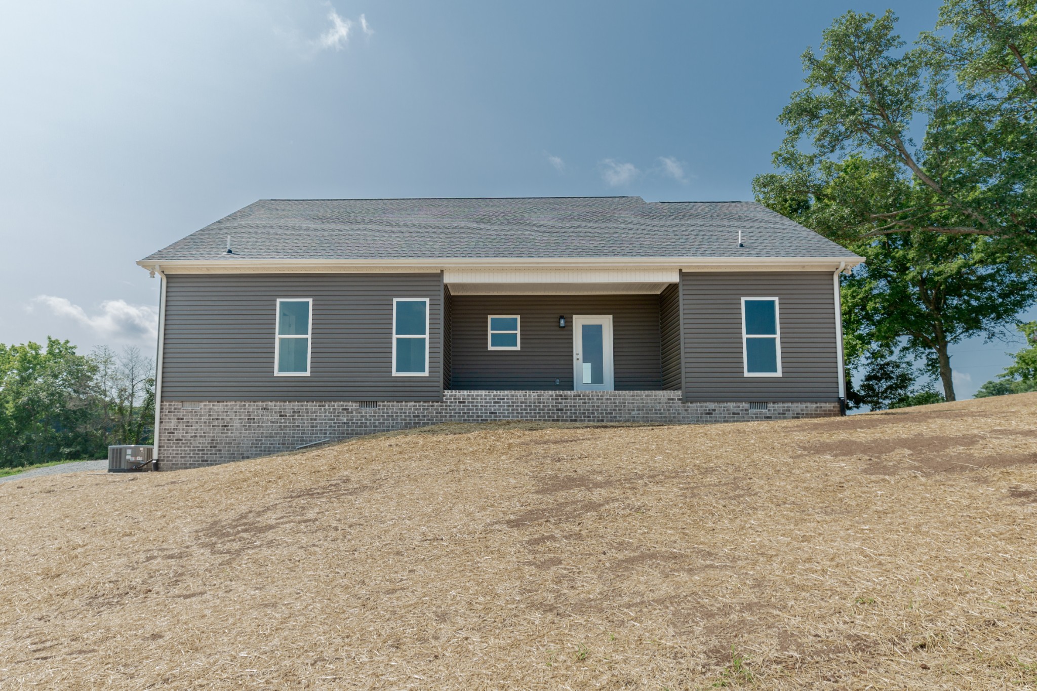 246 Woodruff Road Adams, TN 37010 - Photo 2 of 18 front view of a house with a yard