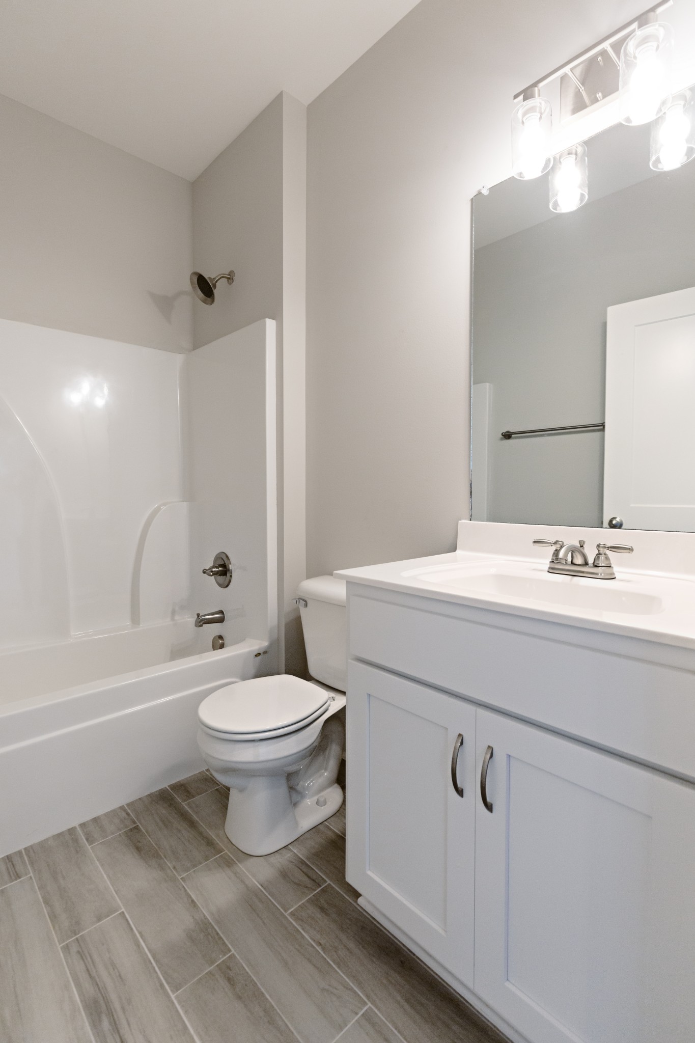 246 Woodruff Road Adams, TN 37010 - Photo 15 of 18 a bathroom with a sink toilet a mirror and shower