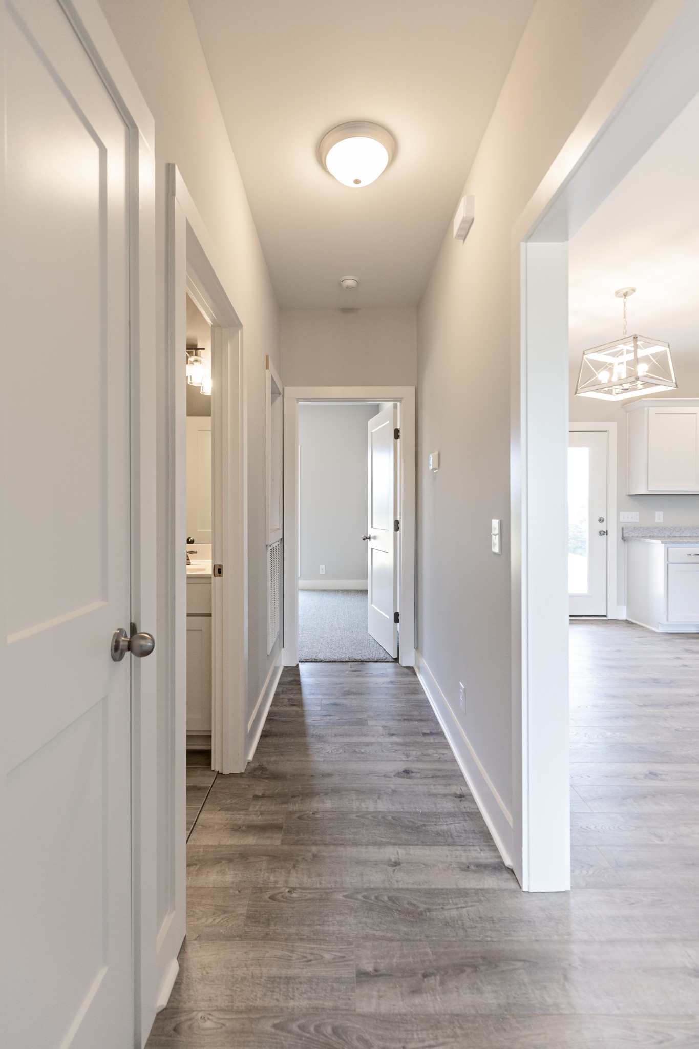 246 Woodruff Road Adams, TN 37010 - Photo 16 of 18 a view of a hallway with wooden floor