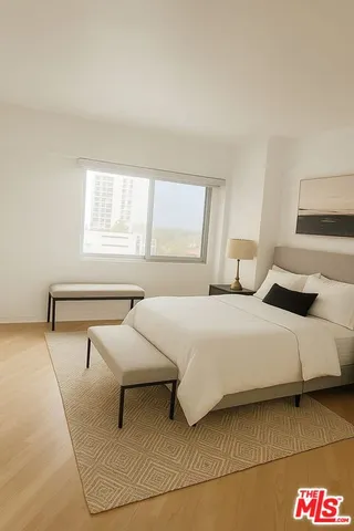 a bedroom with a bed and window