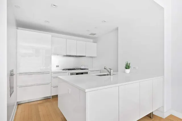 a view of a dining room with furniture and window