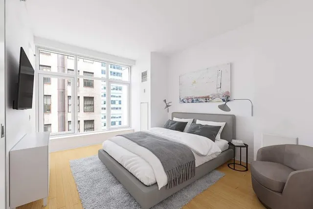 a bathroom with a sink mirror and a shower