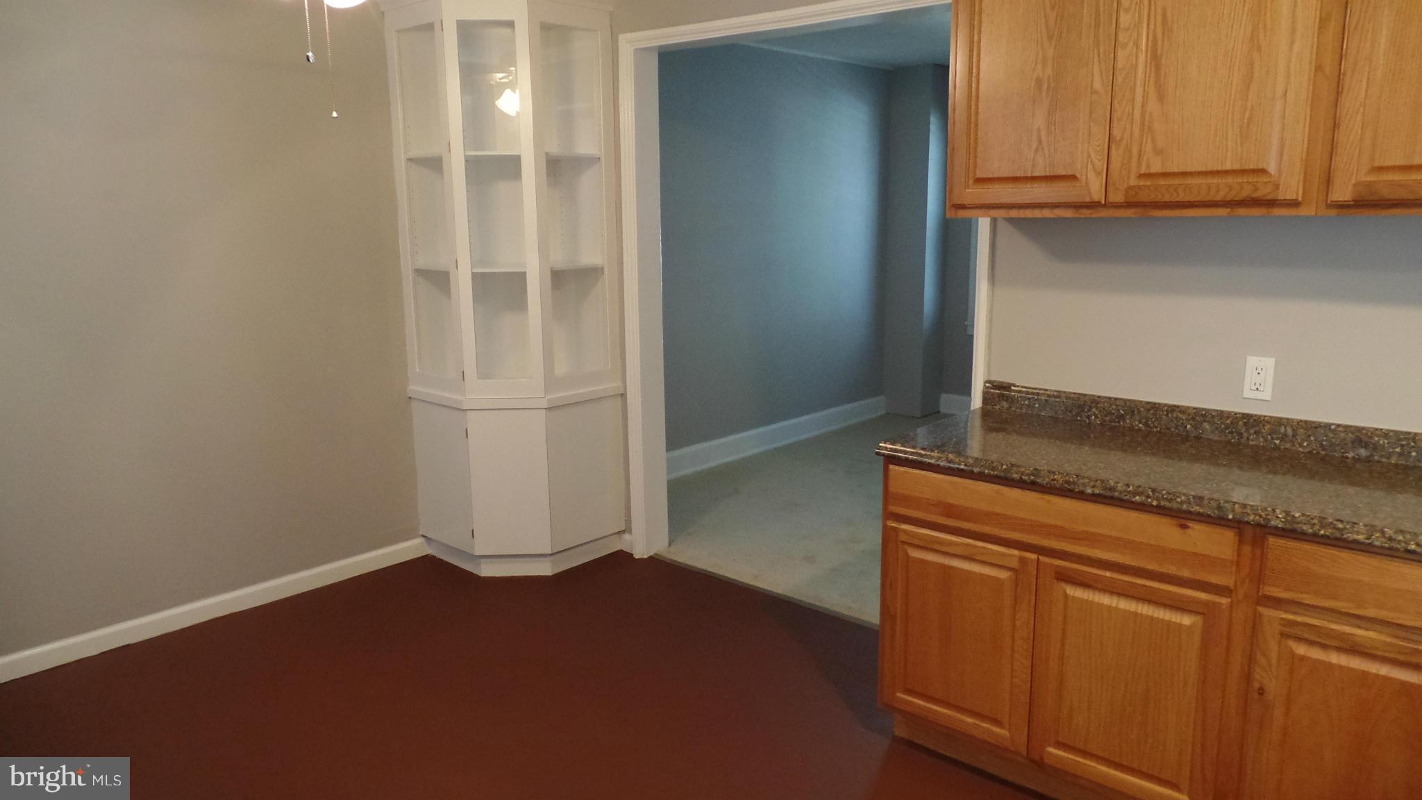 34 Portship Road Baltimore, MD 21222 - Photo 13 of 28 a view of a kitchen with wooden floor and cabinets