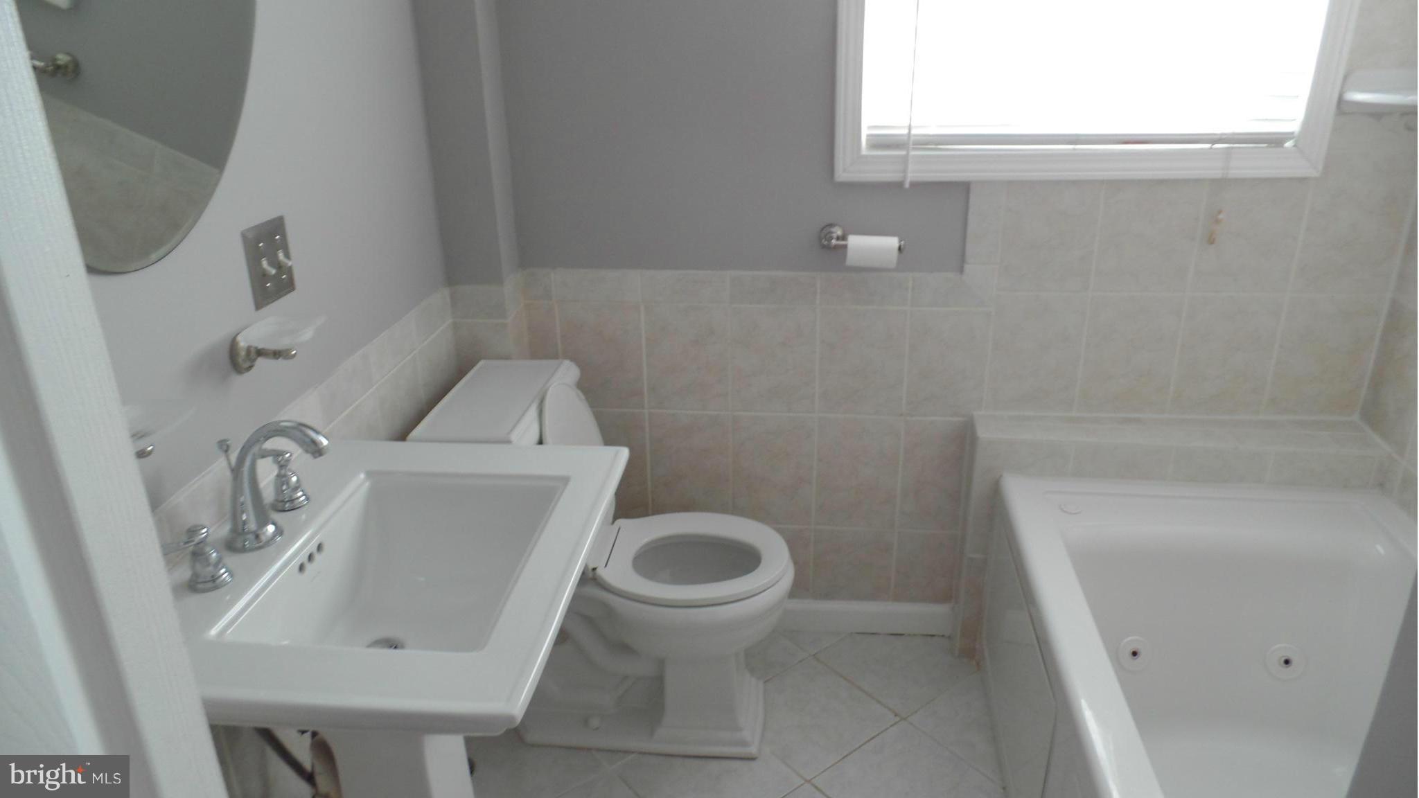 34 Portship Road Baltimore, MD 21222 - Photo 20 of 28 a bathroom with a sink and a toilet