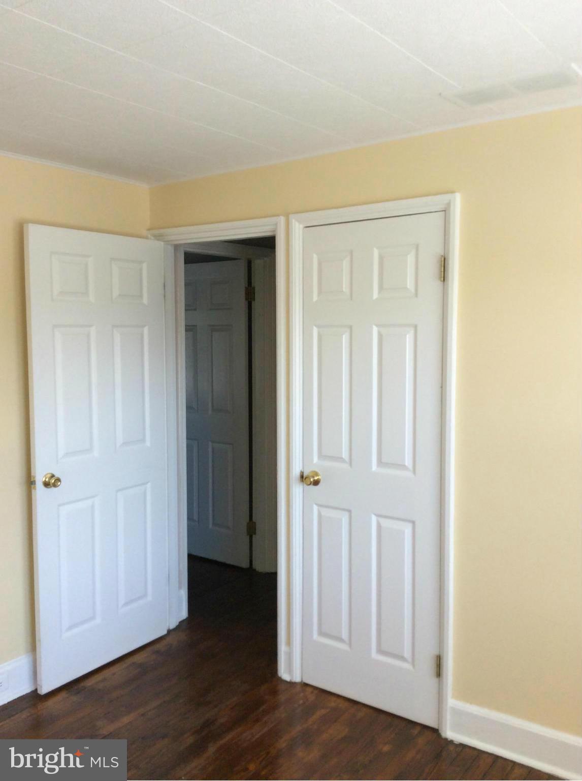 34 Portship Road Baltimore, MD 21222 - Photo 23 of 28 an empty room with wooden floor closet and windows