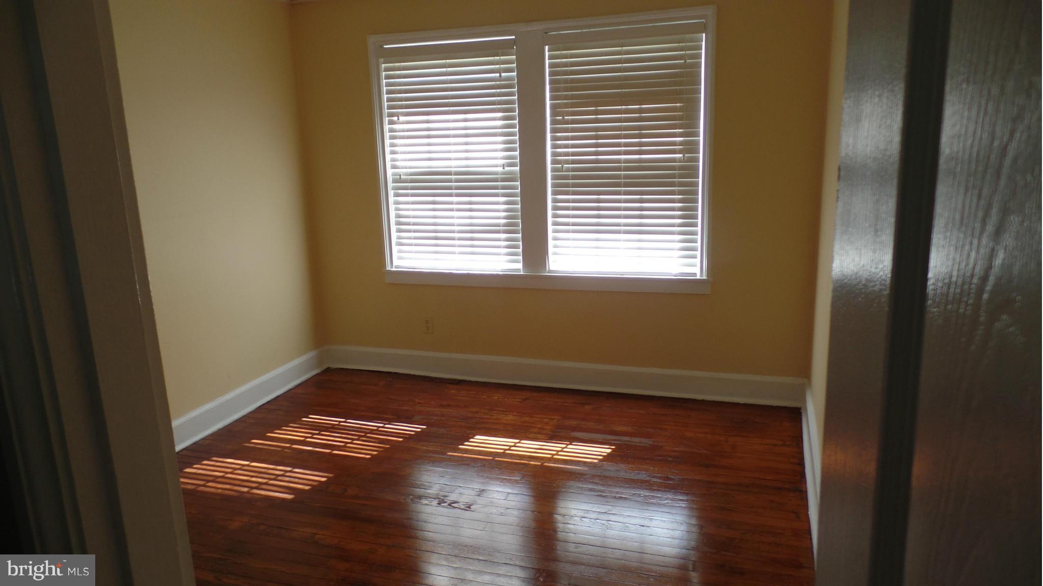 34 Portship Road Baltimore, MD 21222 - Photo 24 of 28 a view of empty room with wooden floor and fan