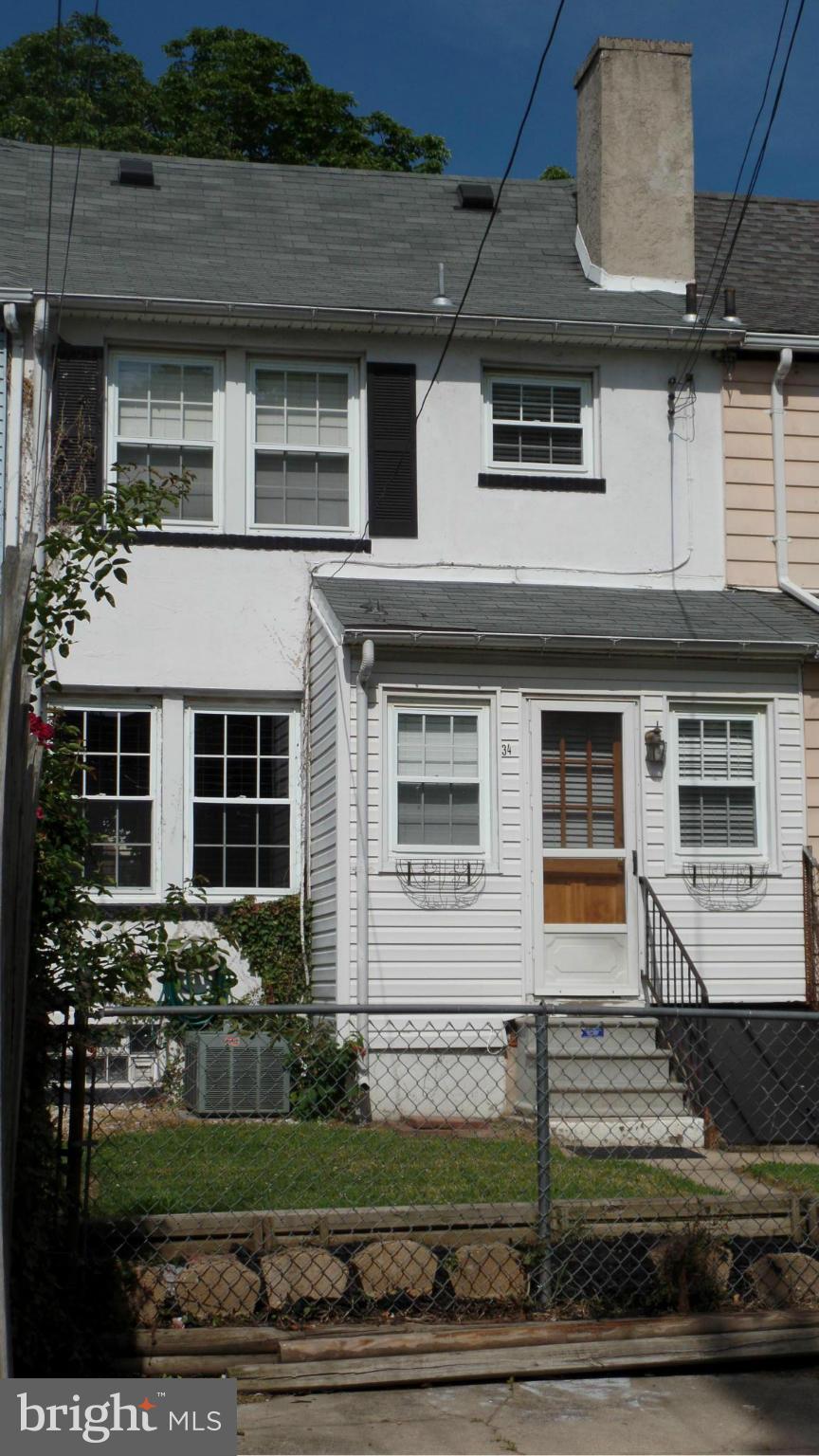 34 Portship Road Baltimore, MD 21222 - Photo 27 of 28 a front view of a house with a yard