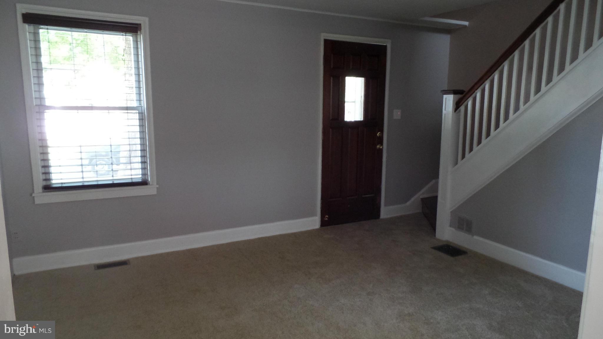 34 Portship Road Baltimore, MD 21222 - Photo 4 of 28 an empty room with windows