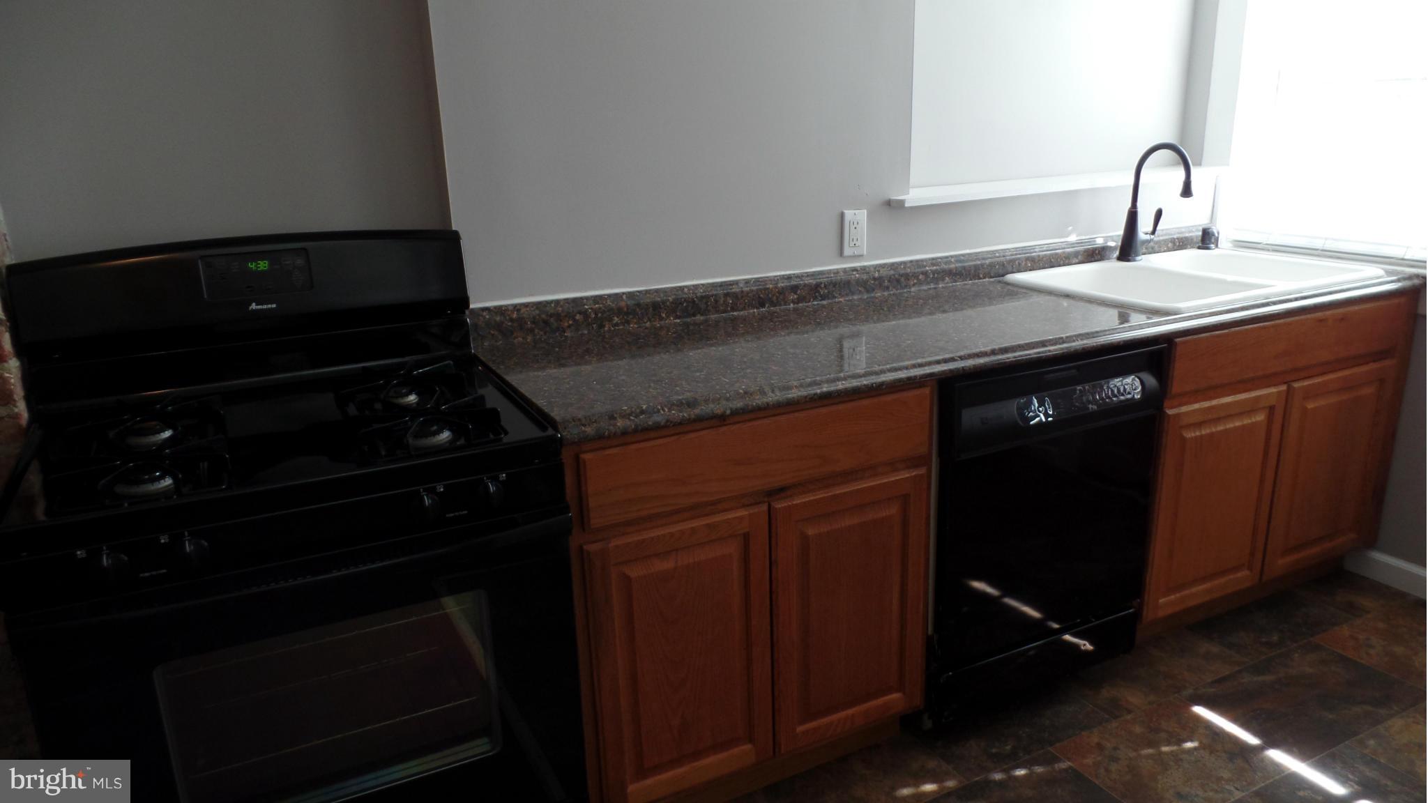 34 Portship Road Baltimore, MD 21222 - Photo 9 of 28 a kitchen with a sink and cabinets
