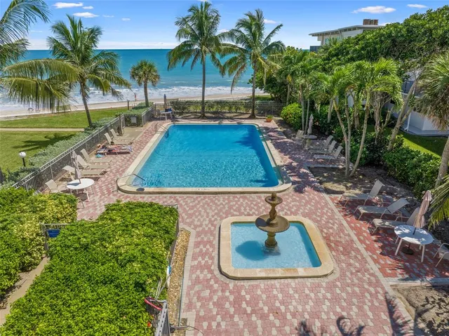 a bedroom with bed and a wooden floor