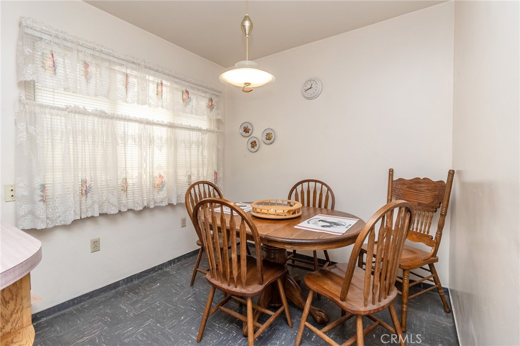 630 Acoma Street Needles, CA 92363 - Photo 14 of 60 a view of a dining room with furniture and chandelier