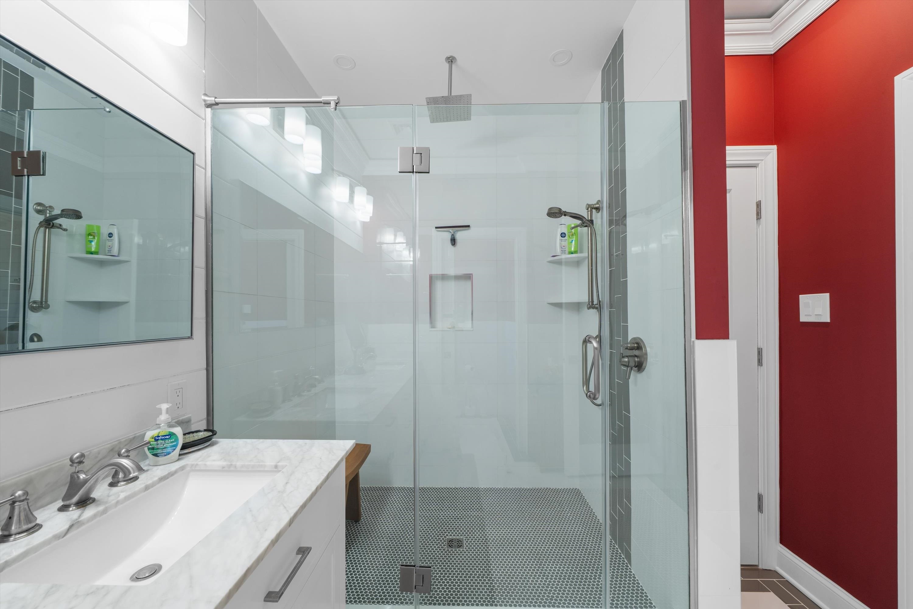 305 East Stockton Road Wildwood Crest, NJ 08260 - Photo 20 of 28 a bathroom with a granite countertop shower sink and mirror