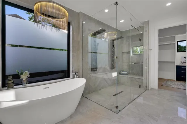 a bathroom with a bathtub and a shower