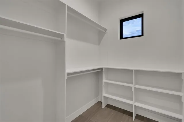 a view of an empty walk in closet