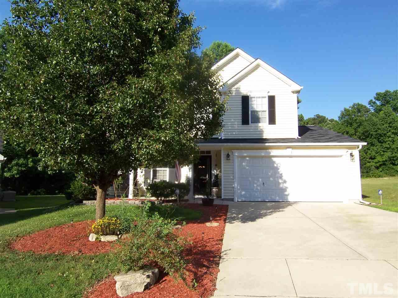 2624 Dality Drive Raleigh, NC 27604 - Photo 1 of 5 a front view of a house with a yard and trees