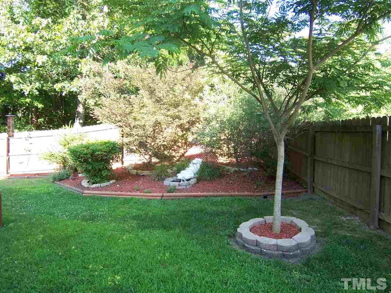 2624 Dality Drive Raleigh, NC 27604 - Photo 4 of 5 a swimming pool with some trees in the background