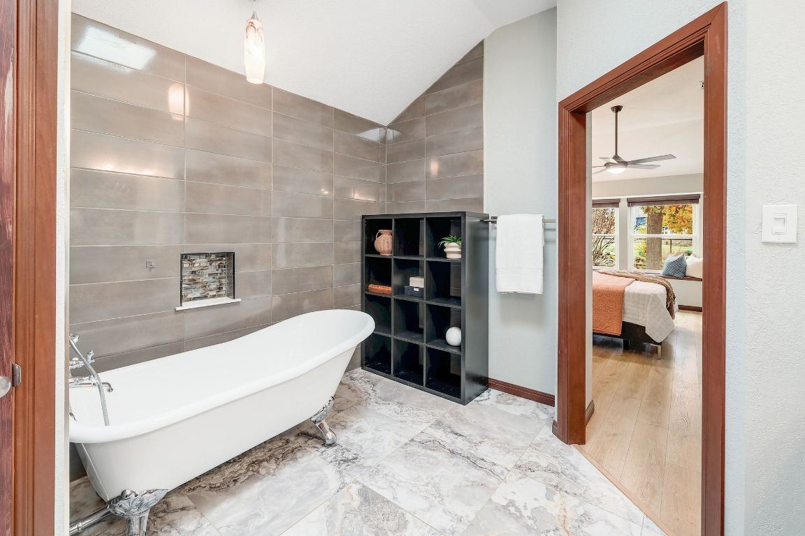 2307 Silverleaf Cove Round Rock, TX 78664 - Photo 16 of 31 a bathroom with a tub and a view of bathroom