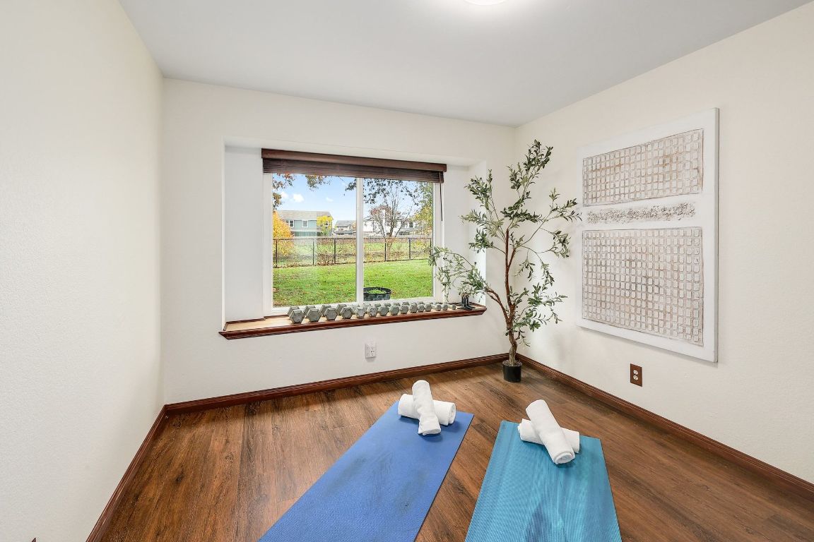 2307 Silverleaf Cove Round Rock, TX 78664 - Photo 17 of 31 a view of empty room with wooden floor and fan
