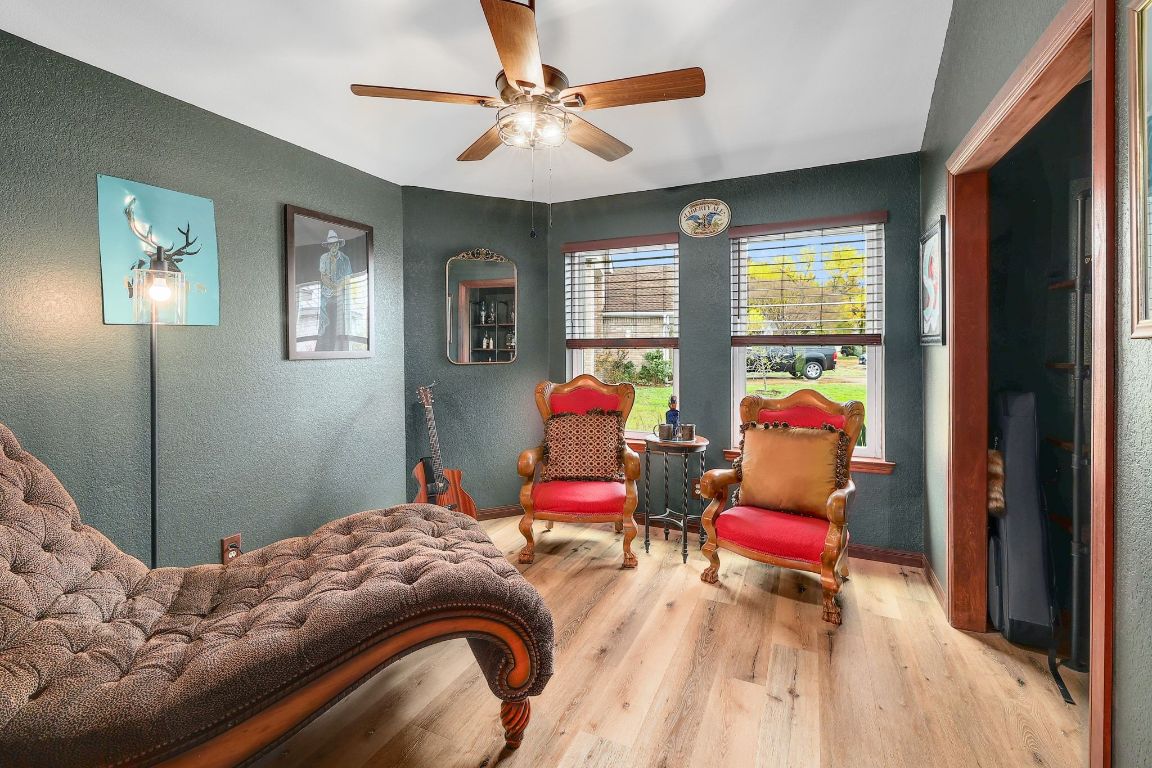 2307 Silverleaf Cove Round Rock, TX 78664 - Photo 18 of 31 a bedroom with a bed chair and a large window