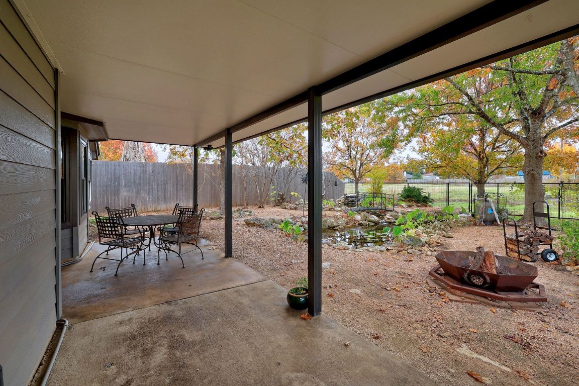 2307 Silverleaf Cove Round Rock, TX 78664 - Photo 22 of 31 a view of a work space with furniture and floor to ceiling window