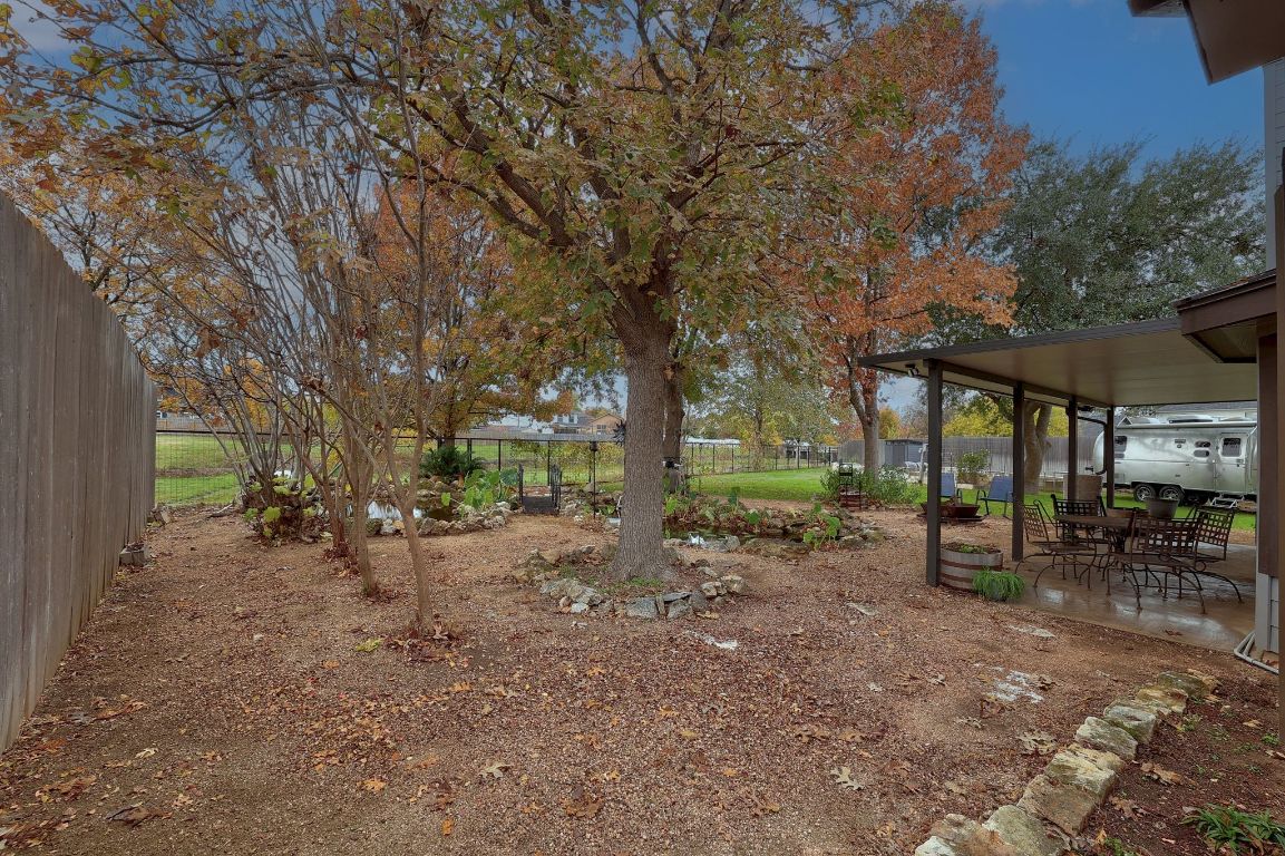 2307 Silverleaf Cove Round Rock, TX 78664 - Photo 24 of 31 a view of a outdoor space with trees in the background