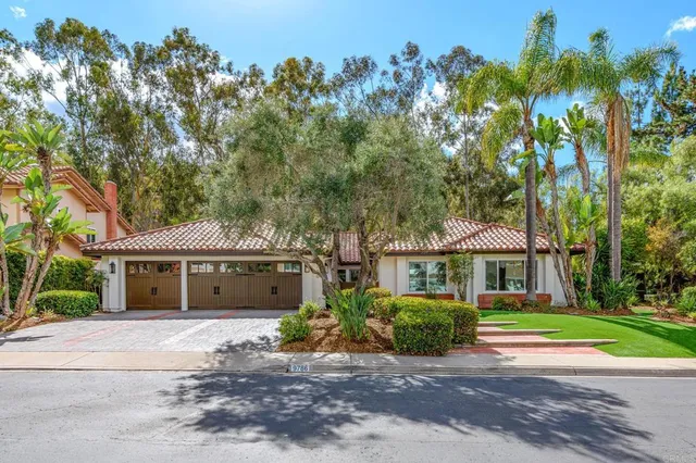 front view of a house with a garden