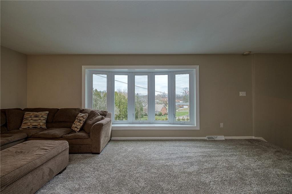 13730 Ridge Road North Huntingdon, PA 15642 - Photo 8 of 24 a living room with furniture and a large window