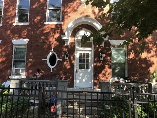 a view of a house with a iron gate