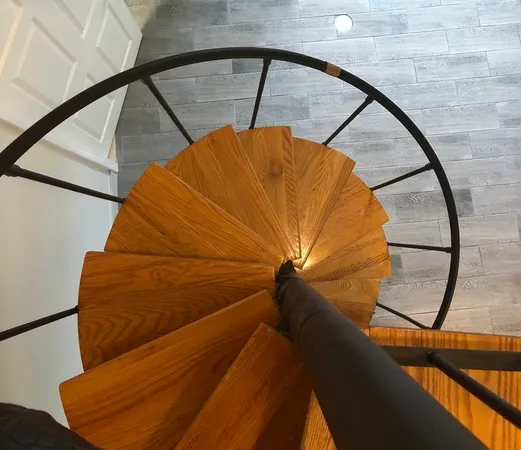 a view of staircase with a rug