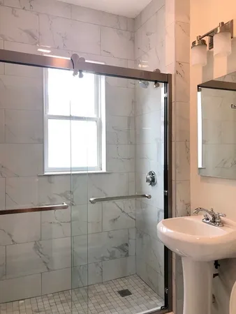a bathroom with a sink and mirror