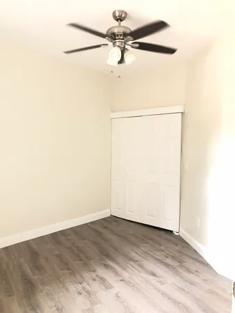 a view of a small space with wooden floor