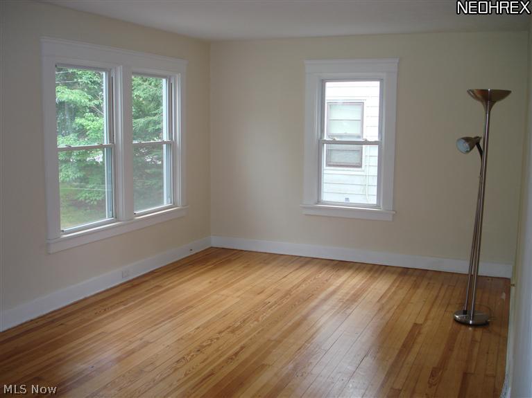 1674 Sunview Road Lyndhurst, OH 44124 - Photo 2 of 23 Beautiful refinished hardwood in livingroom, newer windows, and fresh paint!