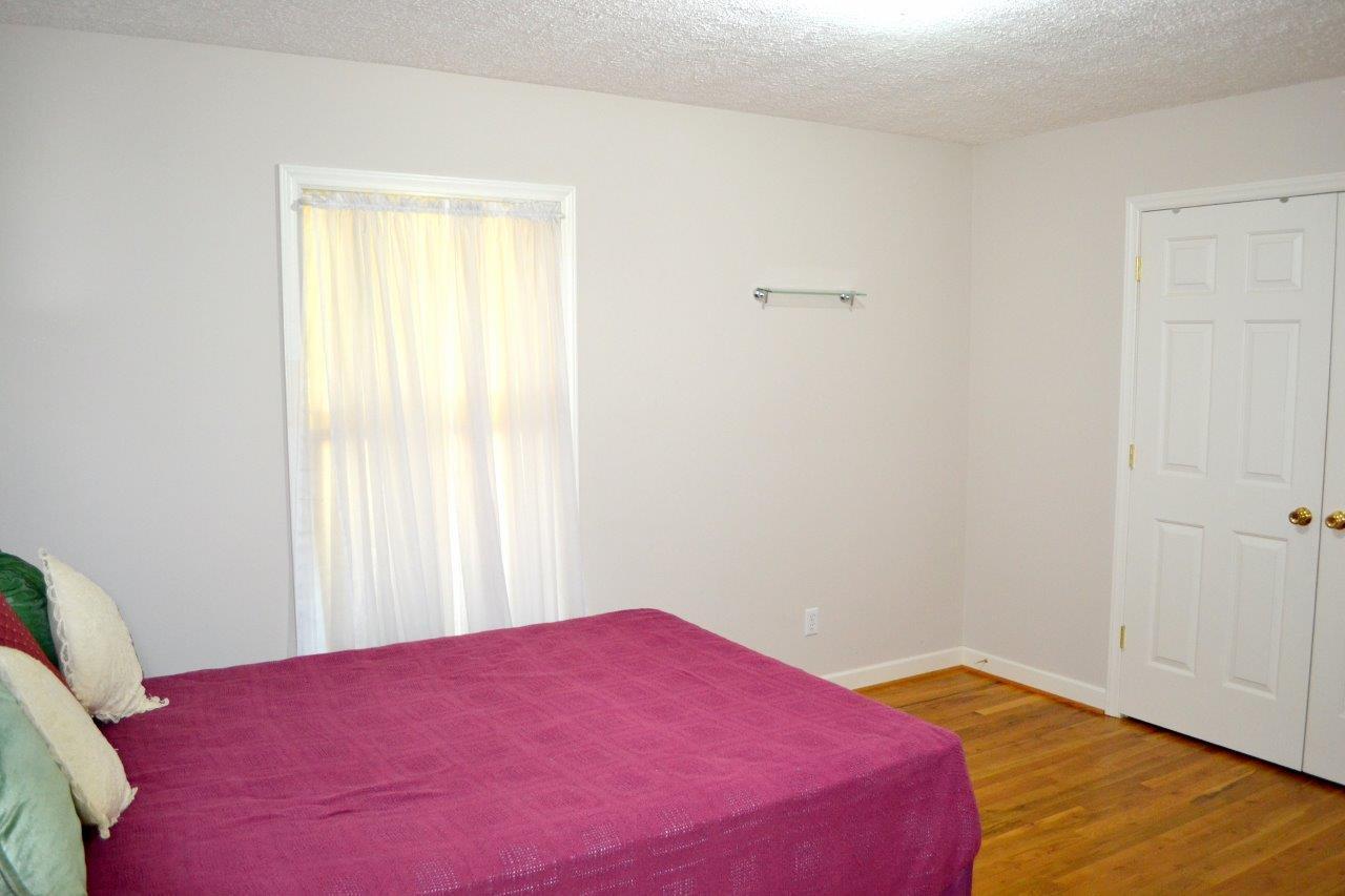 2588 Iron Ridge Road Rocky Mount, VA 24151 - Photo 11 of 65 a bedroom with a bed and a window