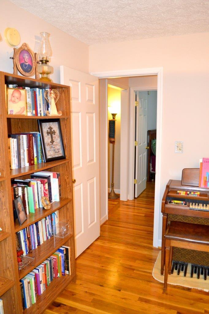 2588 Iron Ridge Road Rocky Mount, VA 24151 - Photo 12 of 65 a view of living room with furniture and book shelf