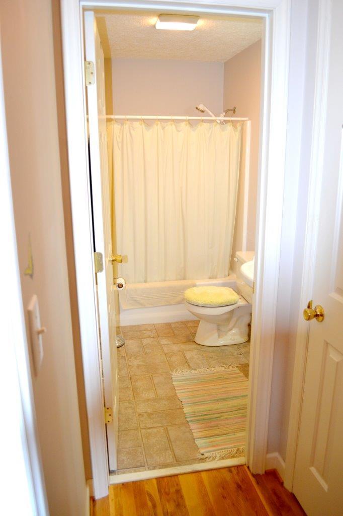 2588 Iron Ridge Road Rocky Mount, VA 24151 - Photo 14 of 65 a bathroom with a granite countertop shower and a sink
