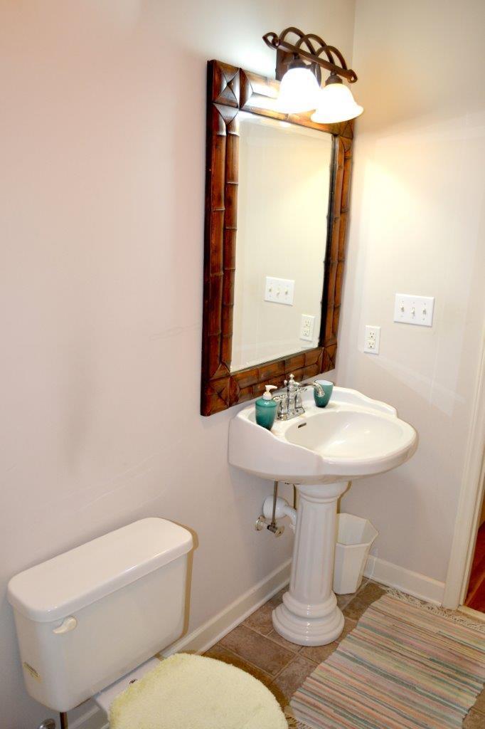 2588 Iron Ridge Road Rocky Mount, VA 24151 - Photo 15 of 65 a bathroom with a toilet sink and mirror