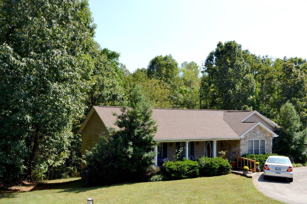 2588 Iron Ridge Road Rocky Mount, VA 24151 - Photo 3 of 65 a front view of a house with a garden